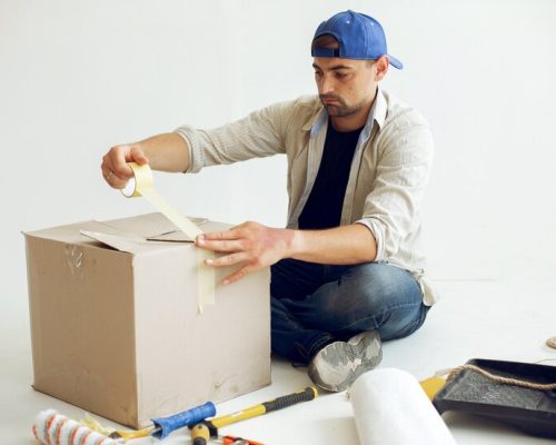 handsome-man-repairs-room_1157-24918